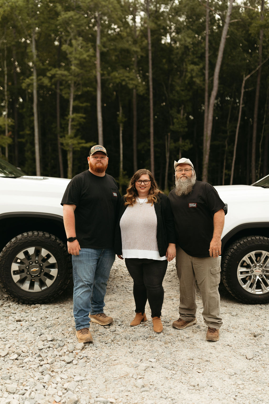 Members of the Scott's Plumbing family standing next to their truck